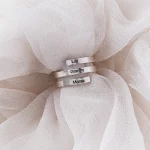 Silver Custom Name Ring on white fabric